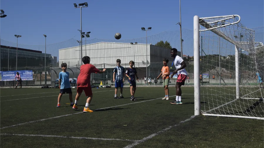 Young participants in the football activity at The Village international camp