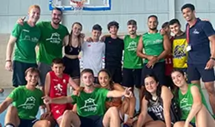 Basketball coaches leading a practice session at the English camp.