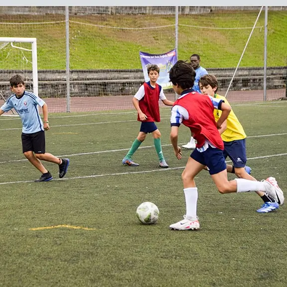 Group of participants training soccer at the summer camp