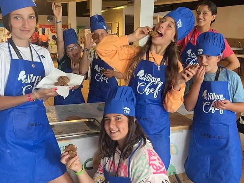 Youth at the summer camp in Spain enjoying their creations during the cooking activity