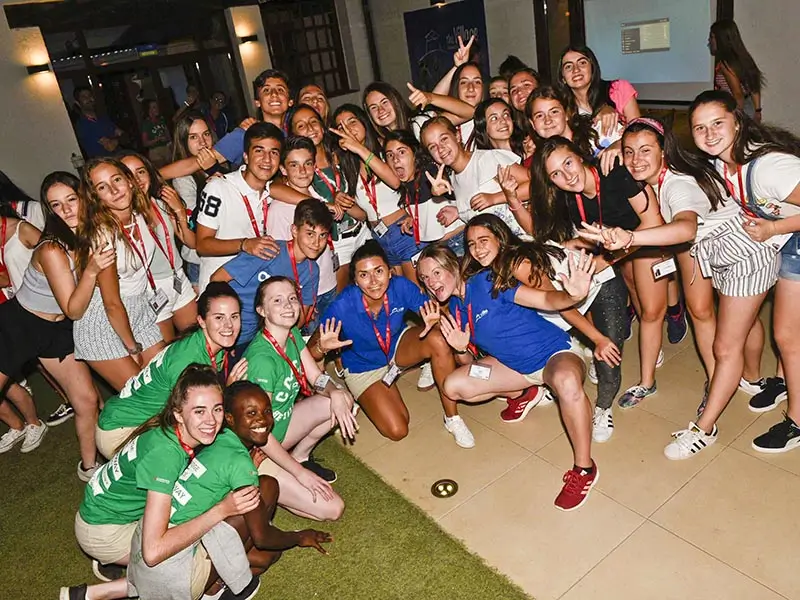 A group of young people having fun at a party at the summer camp in Spain for teens the Village